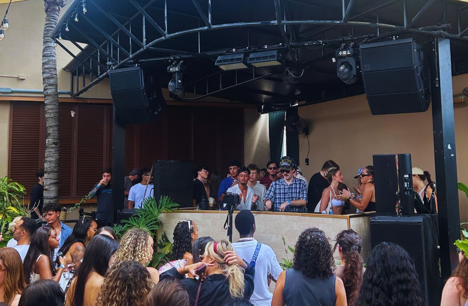 Picture of a DJ performing during the day.