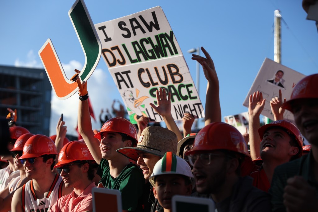 UM fans hold up a poster reading "I saw DJ Lagway at Club Space last night"