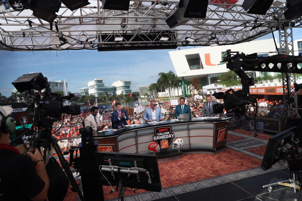 backstage view of hosts hosting a sports panel