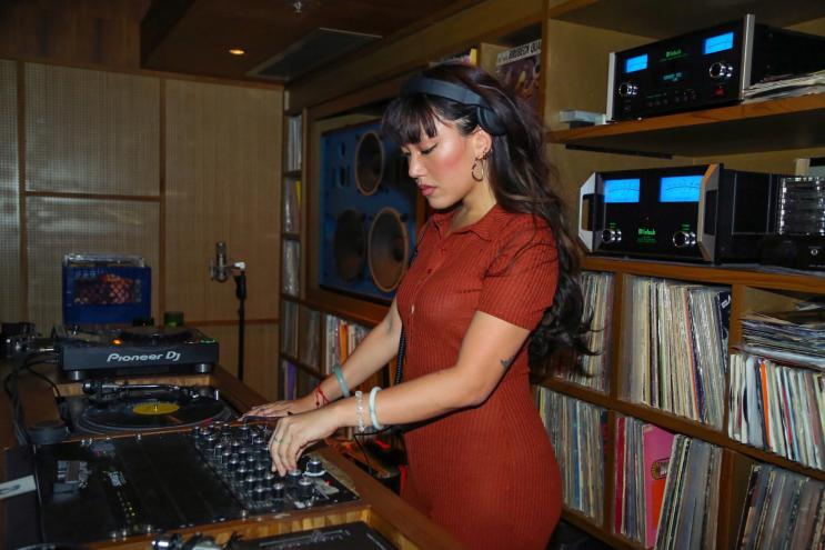 Picture of an Asian woman DJing