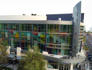 aerial view of a movie theater with multicolored windows and a sign reading "Lincoln"