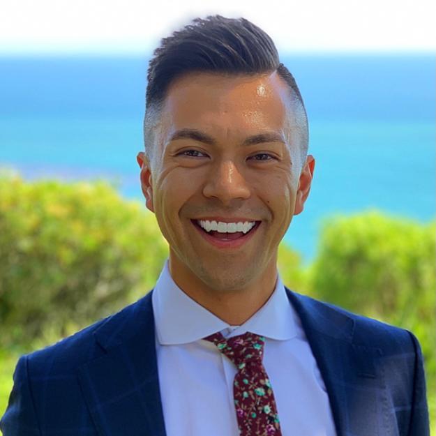 photo of a smiling man at the seaside