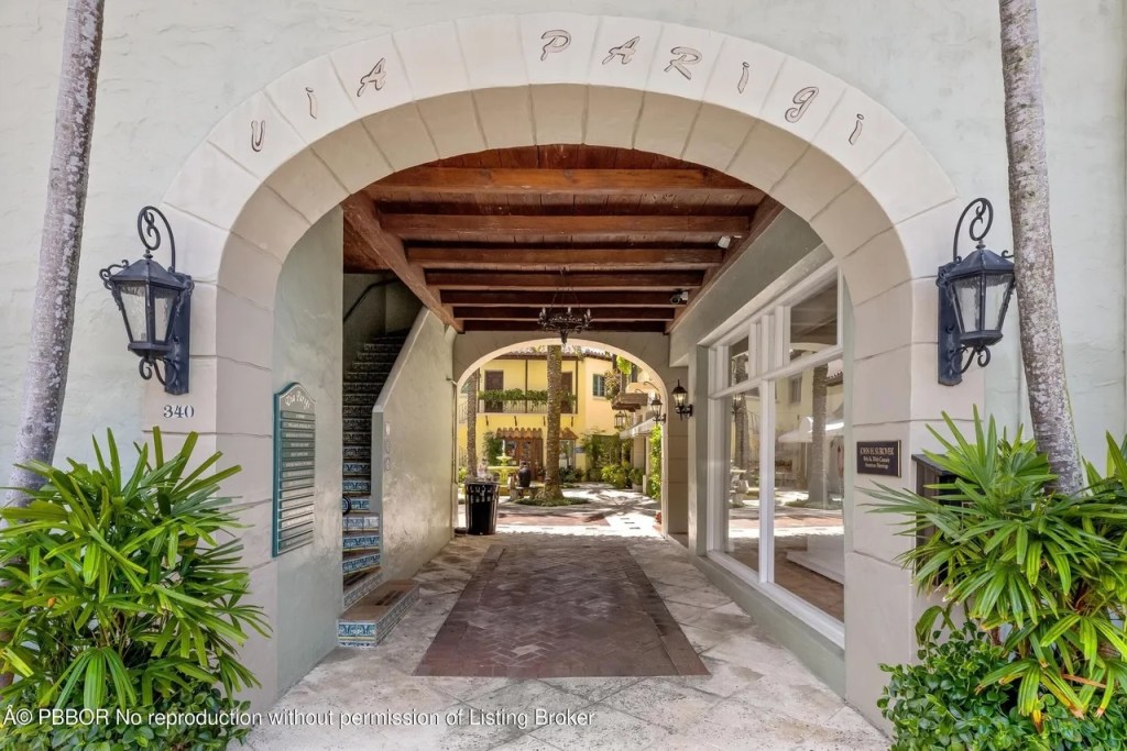 Depicted is an arched entryway into a courtyard beneath the penthouse tower.