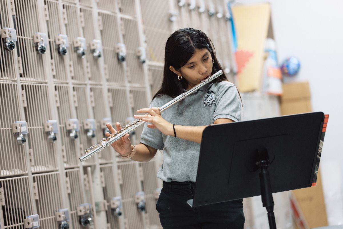 Photo of a girl playing the flute.