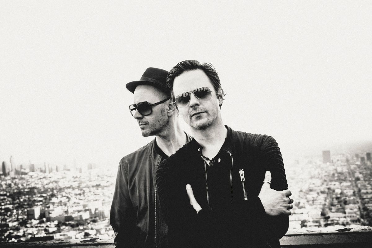 Black and White picture of two men posing for the camera.