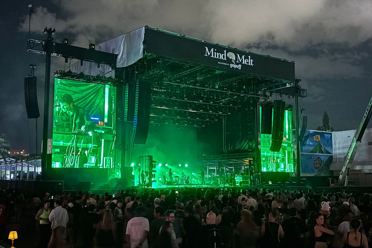 A band playing at a festival stage.