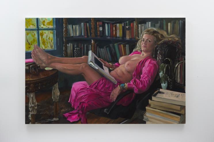 painting of a topless woman lounging in a library reading a book in a pink robe