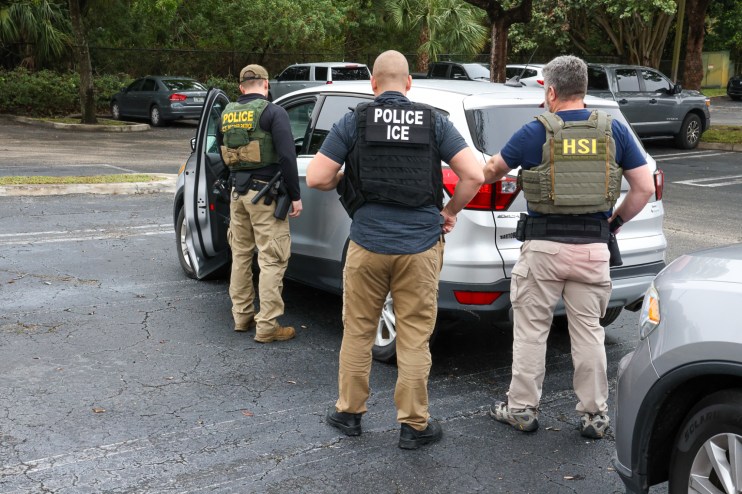ICE officers, with assistance from Homeland Security Investigations and Border Patrol perform enforcement operations in Delray Beach, Florida on Jan. 23.