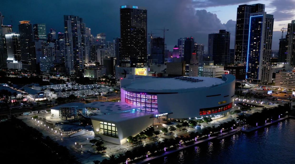 aerial view of Miami's Kaseya Center arena with the city skyline behind it