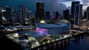 aerial view of Miami's Kaseya Center arena with the city skyline behind it
