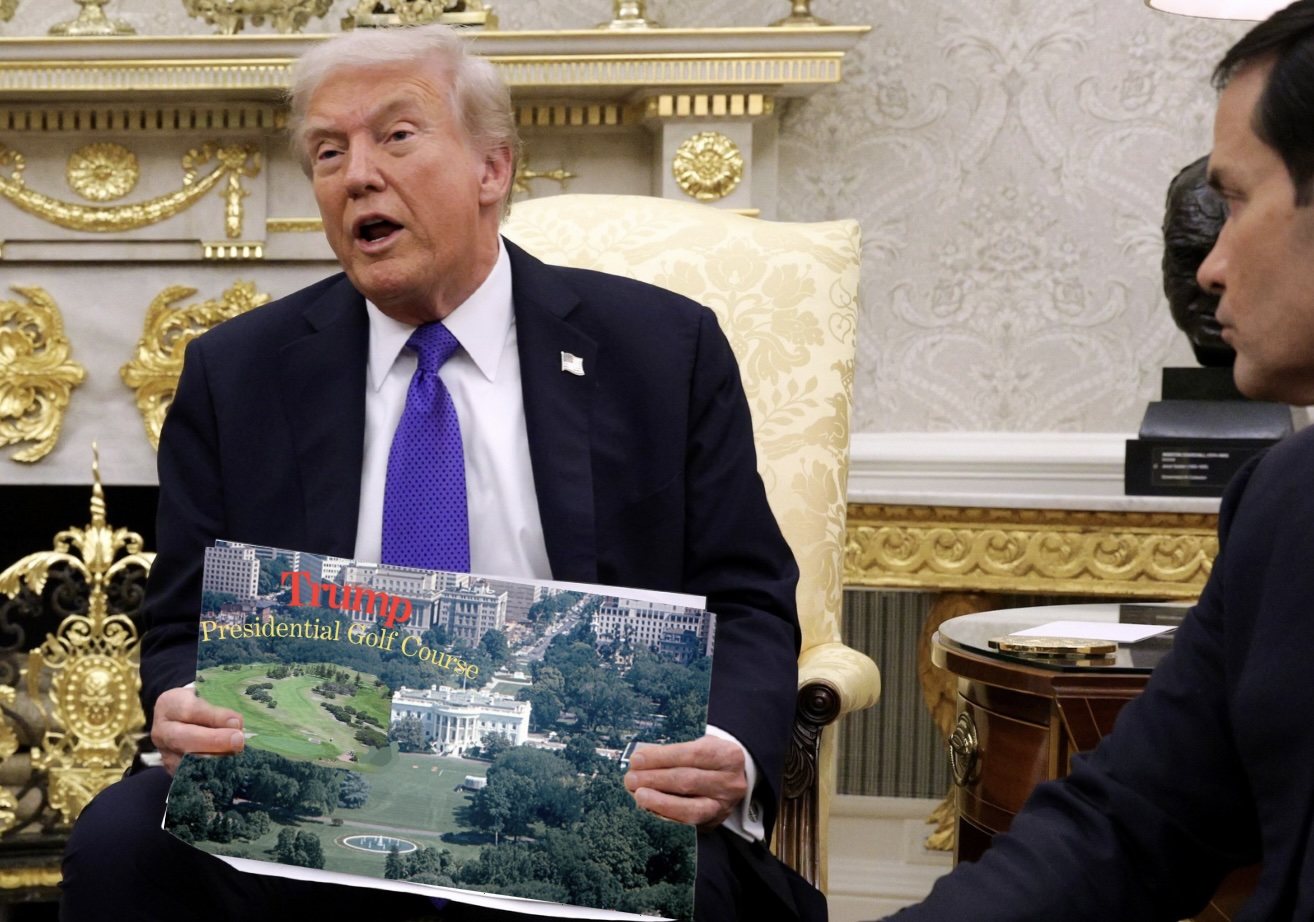 President Trump holds a collaged photo by New Times of a golf course on the White House grounds