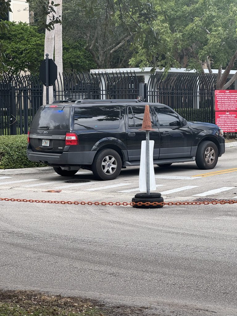 Unmarked Black Ford SUV entering ICE office in Miramar