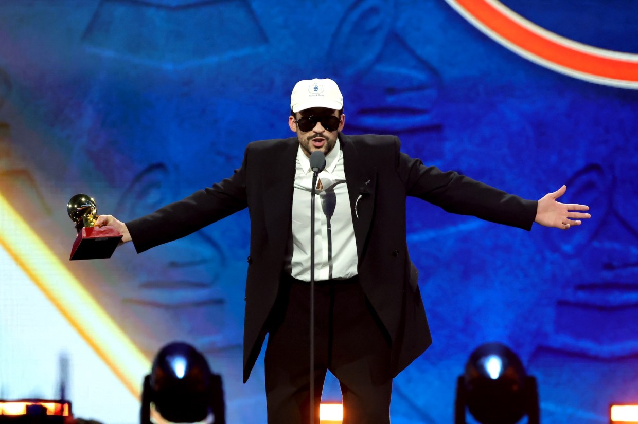 Photo of Bad Bunny on stage holding an award