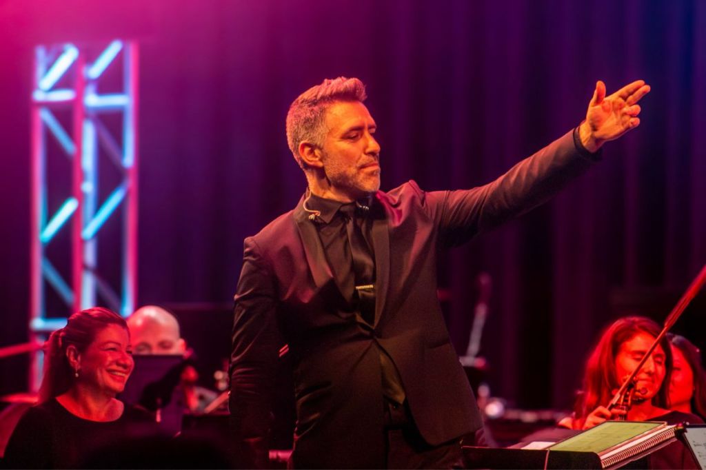 A conductor on stage.