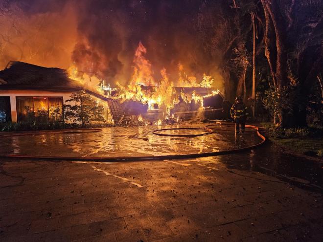 Miami Dade Fire Rescue work to put out a massive fire at Miami Heat coach Erik Spoelstra's home