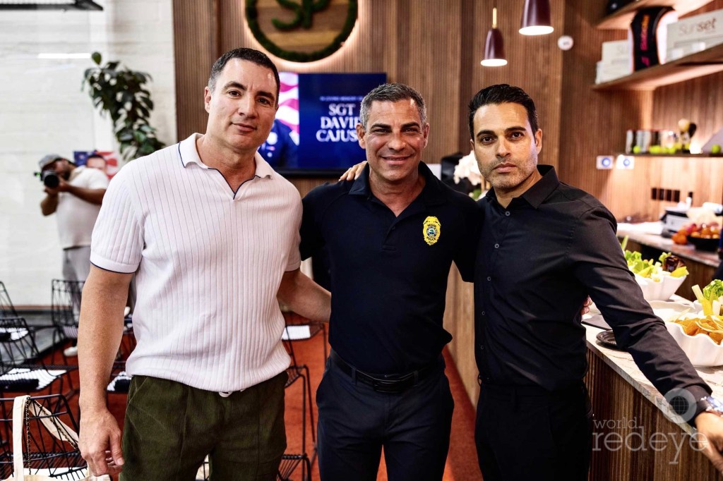 photo of Chris Paciello, Mayor Francis Suarez, and Rafi Gibly posing together next to a buffet