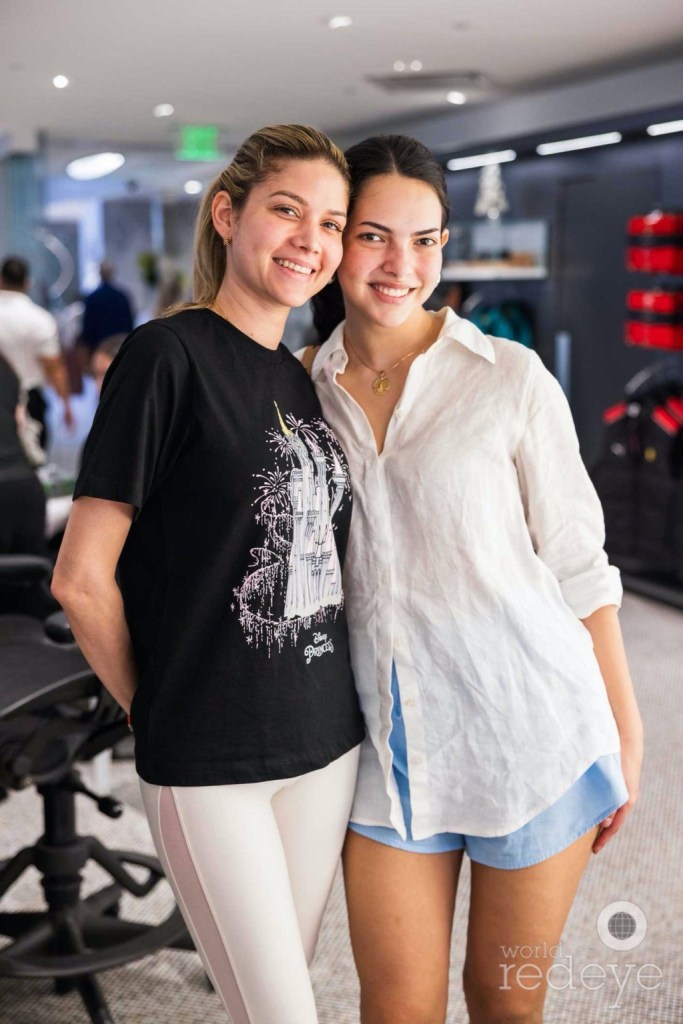 photo of two young women posing together in casual wear