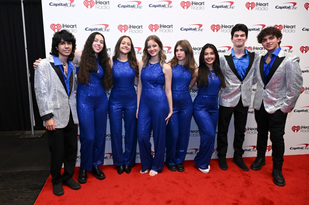 an eight-piece band wearing blue clothes
