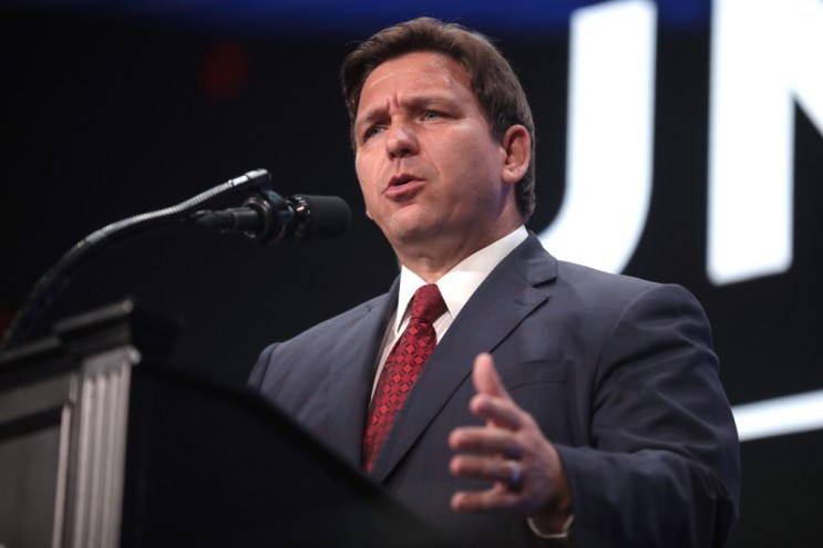 Ron DeSantis speaking at a podium