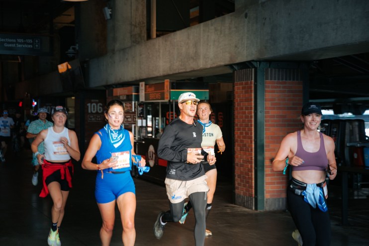 photo of a group of people running