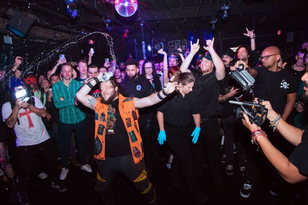 people dancing in a mosh pit 