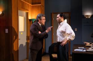 photo of two theater actors performing onstage