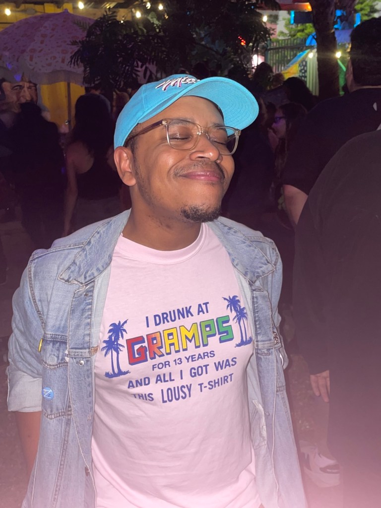 A man wearing a shirt that reads I drunk at Gramps for 13 years