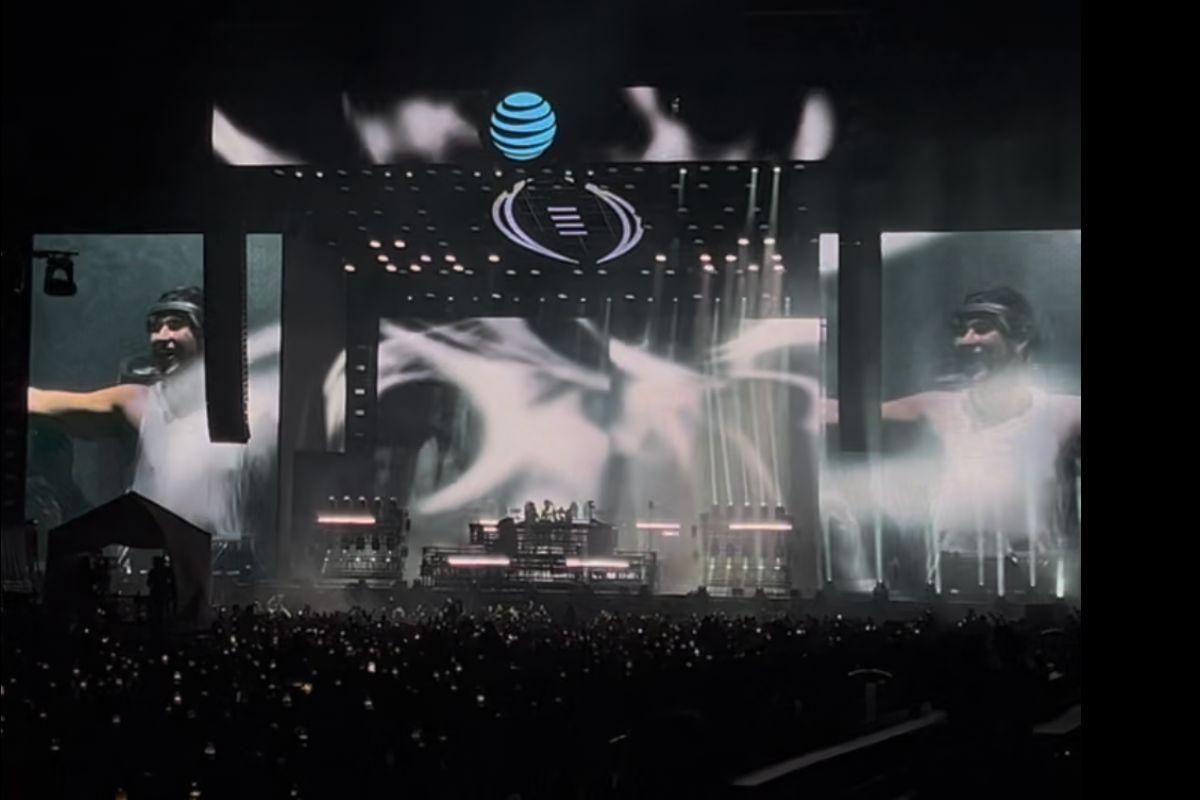 a DJ on stage at an edm concert
