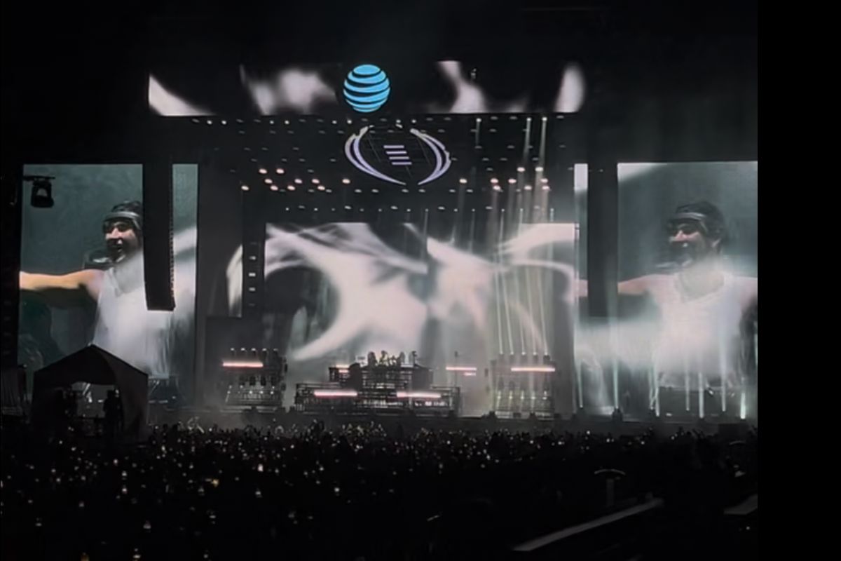 a DJ on stage at an edm concert