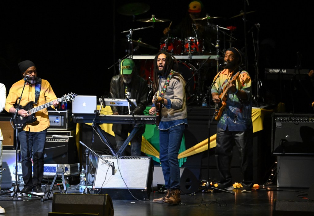 A reggae band performing on stage 