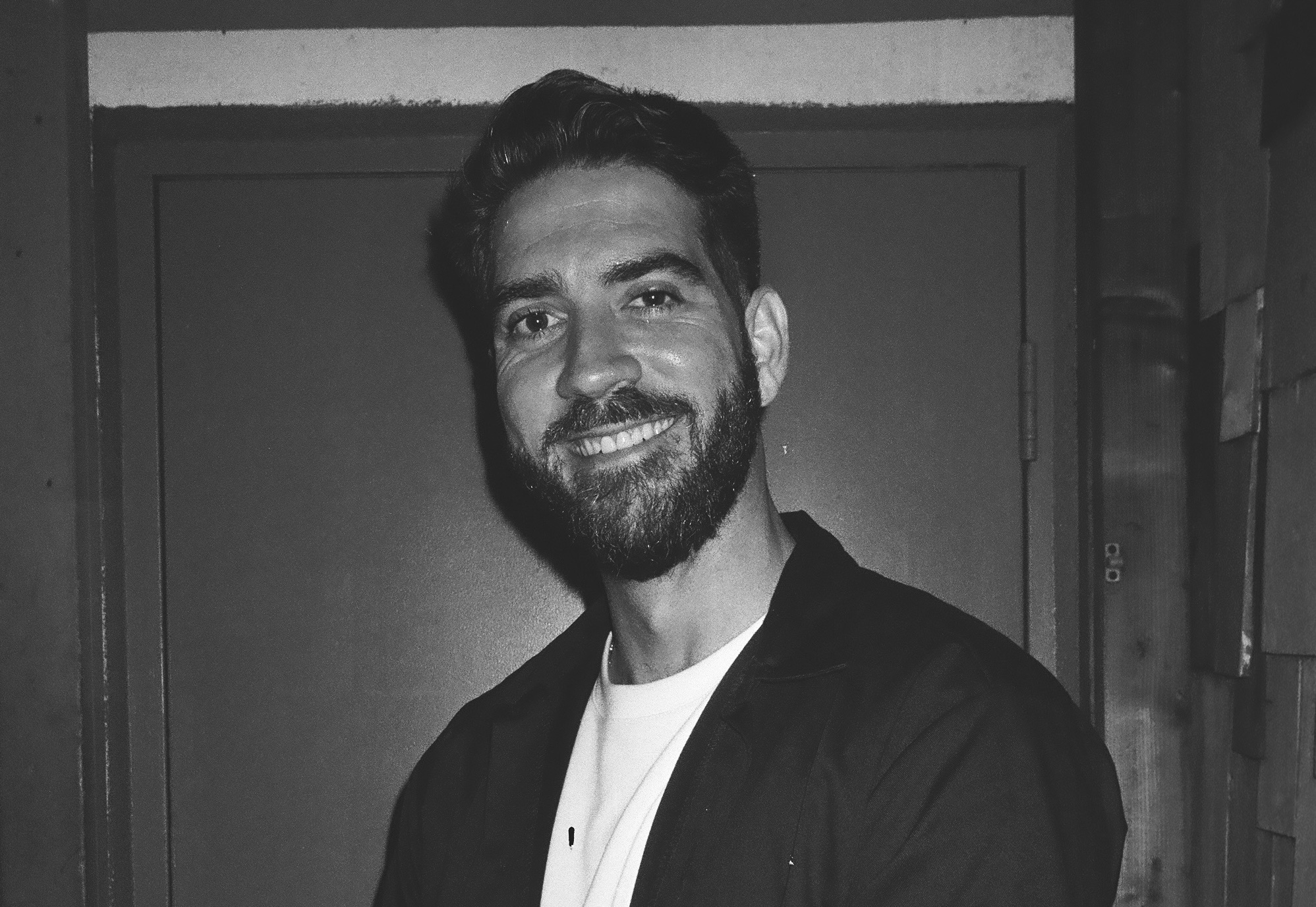 black-and-white portrait of comedian Sergio Mendez