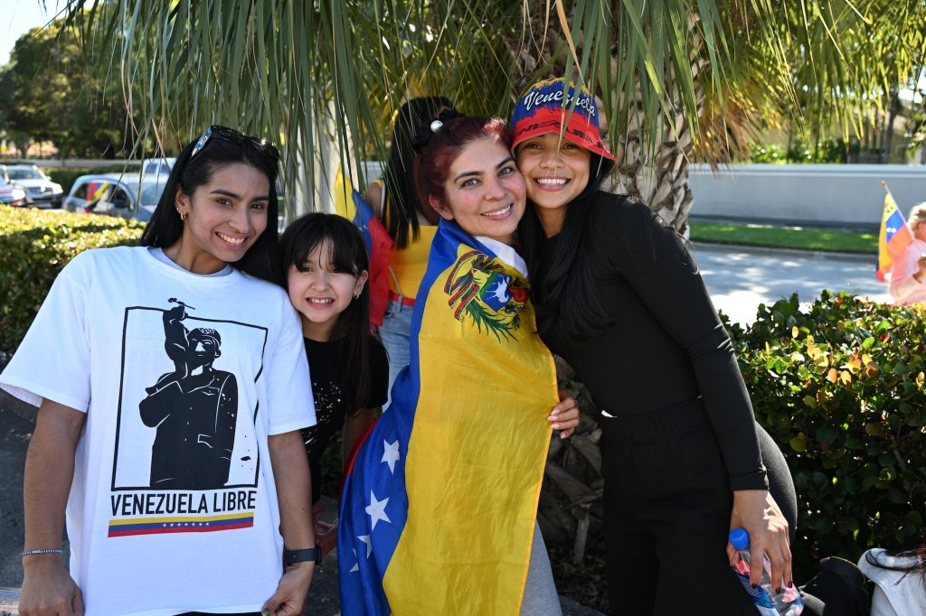 photo of a family wearing clothing with the Venezuelan flag