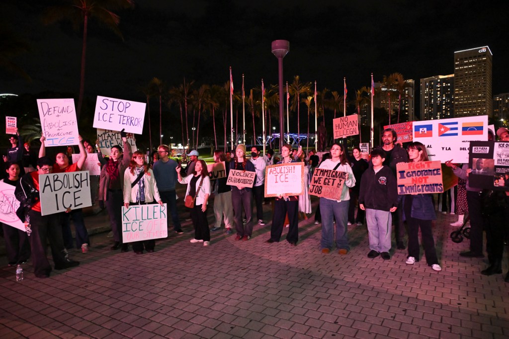 photo of protesters holding signs