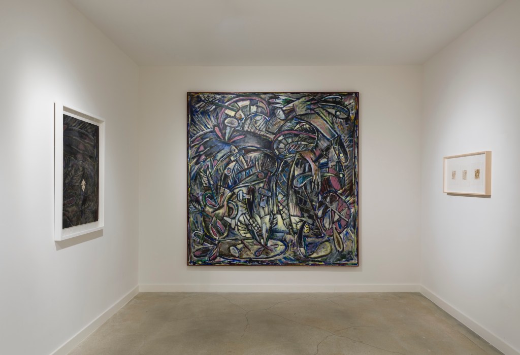 photo of a painting hanging on a wall inside a gallery