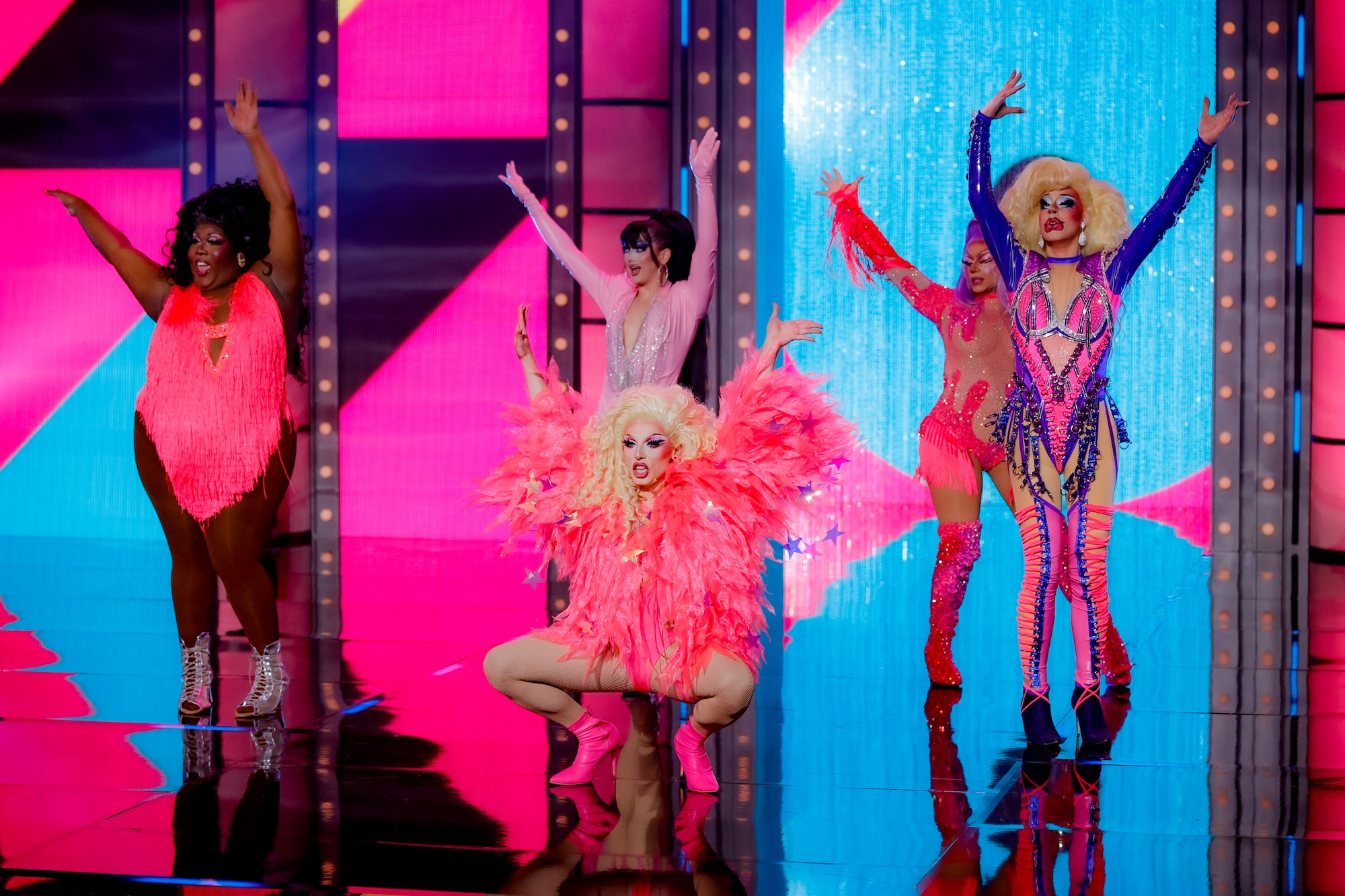 photo of drag queens in costume performing onstage on RuPaul's Drag Race