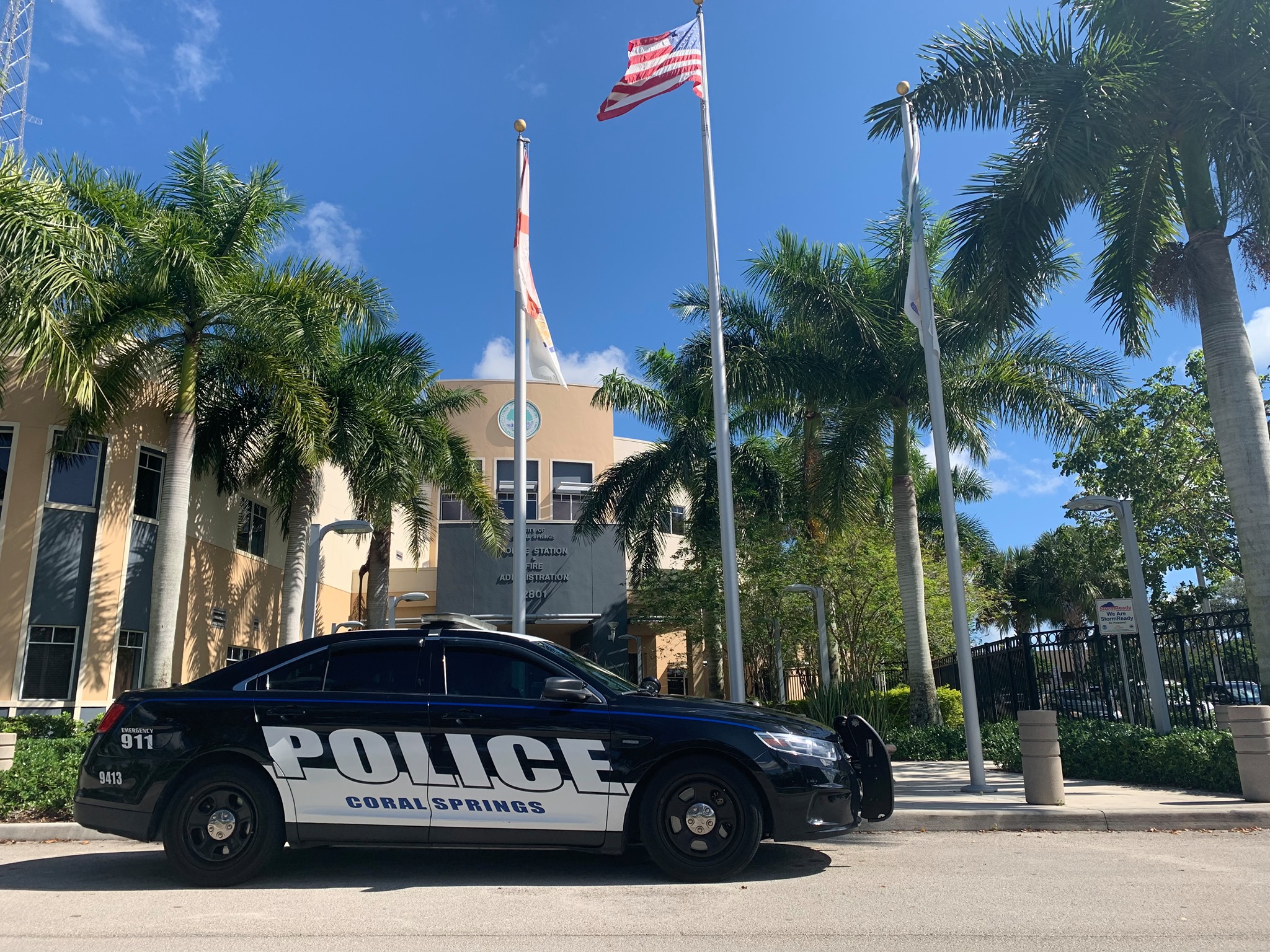 a police car is parked outside a building