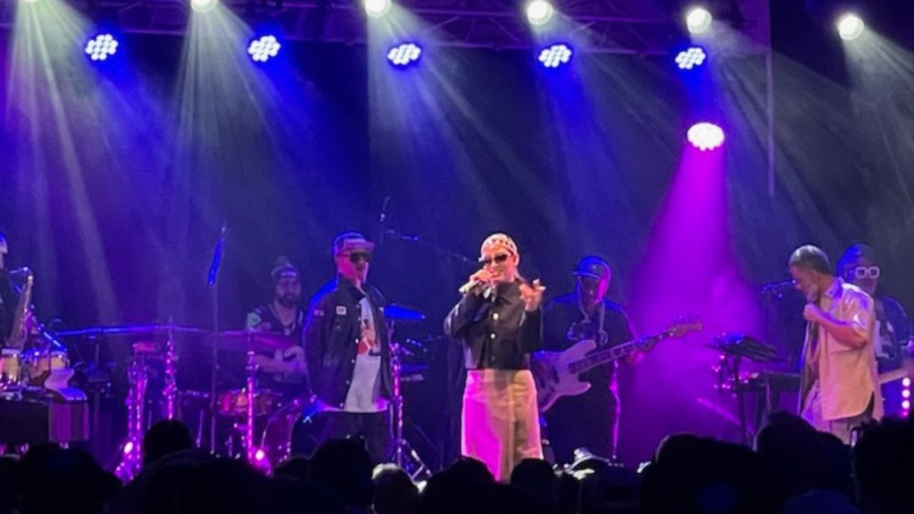 Photo of a woman singing on stage