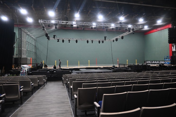 photo of a empty arena seats in front of a jai-alai court
