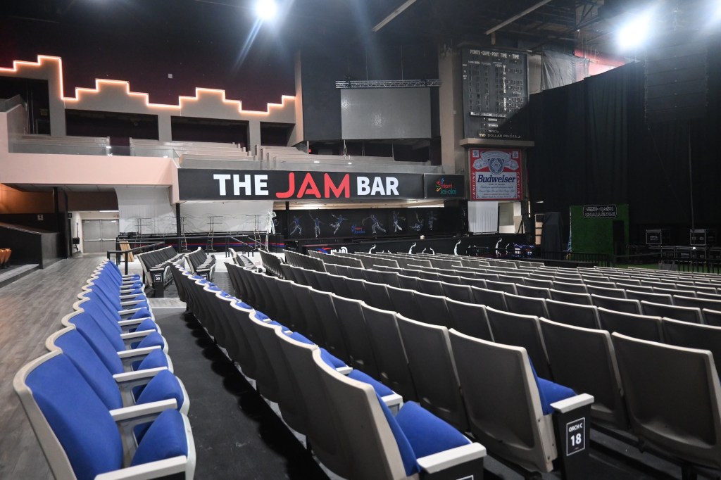 photo of an auditorium with a bar in the back with a sign reading, "The Jam Bar"