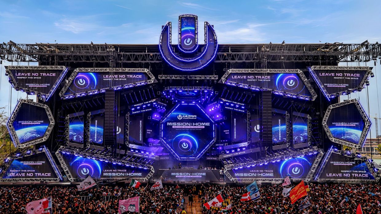Photo so a stage at Ultra that reads mission home