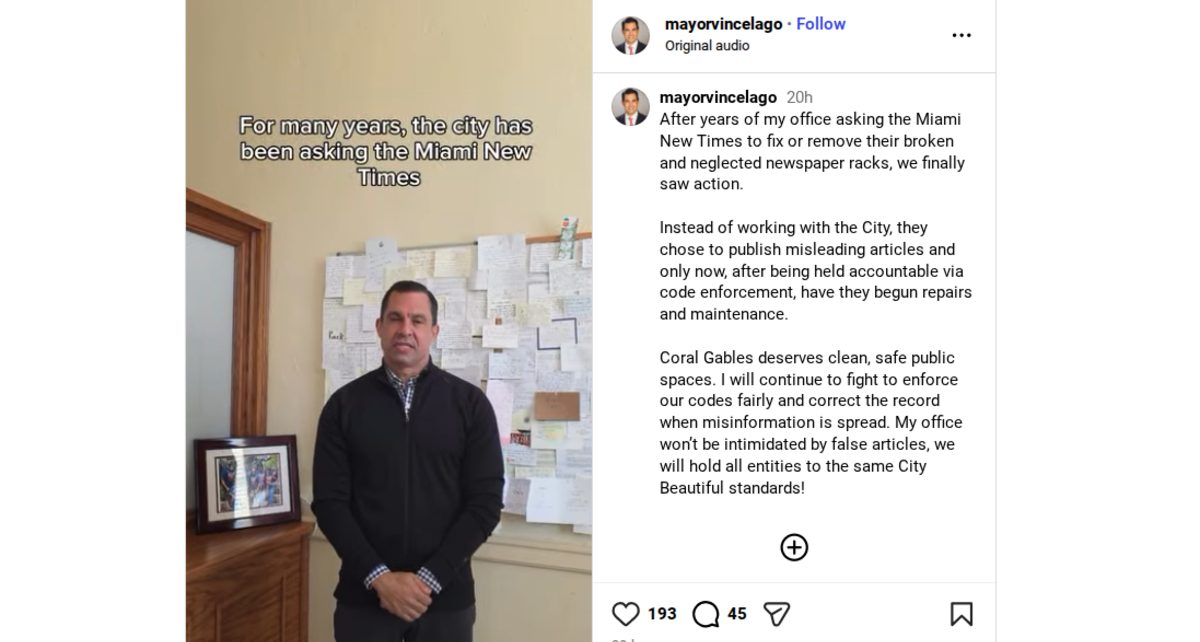 Screenshot of Coral Gables Mayor Vince Lago's video where he is standing in his office wearing a quarter zip and his hands folded in front of him.