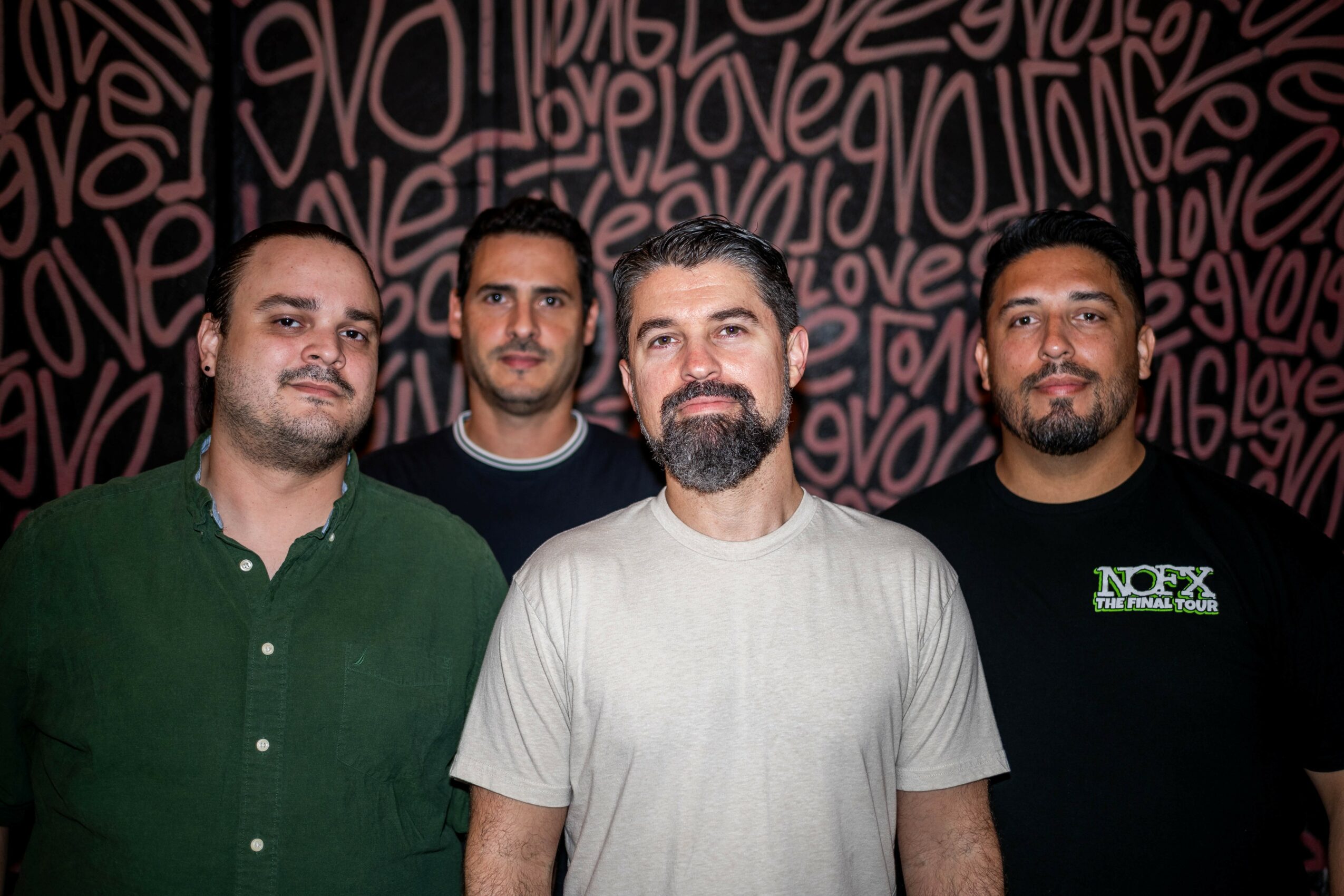 Photo of a band posing for the camera