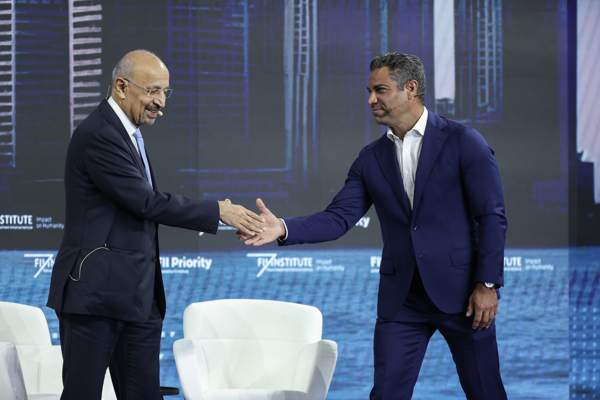 H.E. Khalid bin Abdulaziz Al-Falih, Minister of Investment, Ministry of Investment of Saudi Arabia and Mayor Francis Suarez of Miami, shake hands on stage at the FII Priority Summit last year.