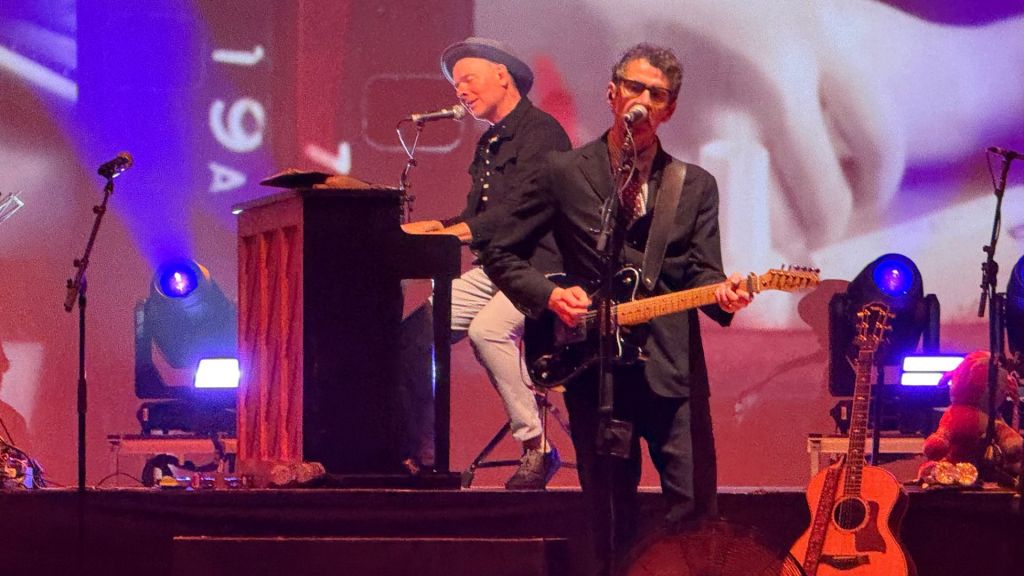 Photo of Belle and Sebastian performing in Miami.