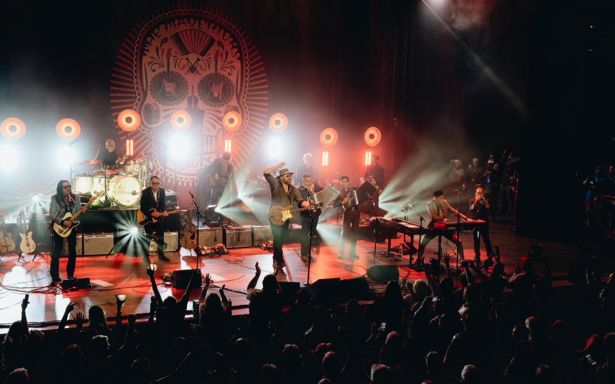 Photo of country band The Mavericks on stage.