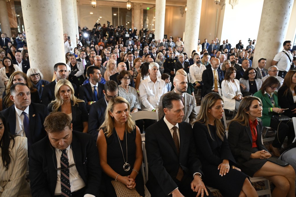 photo of an audience sitting for a press conference