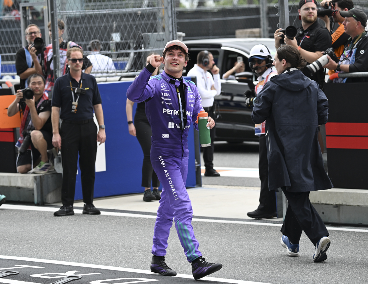 photo of Mercedes driver Kimi Antonelli fist pumping to a crowd in the stands at the Miami Grand Prix