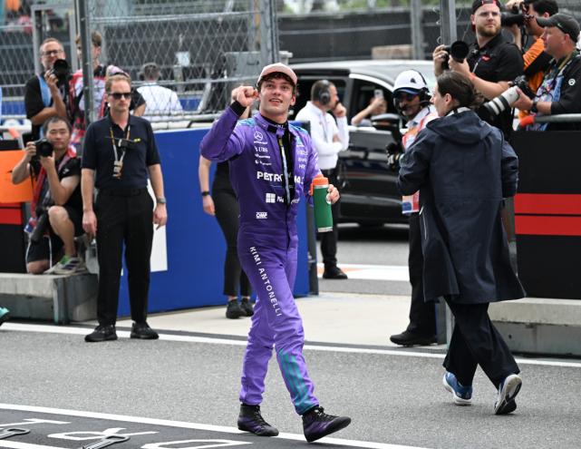 photo of Mercedes driver Kimi Antonelli fist pumping to a crowd in the stands at the Miami Grand Prix