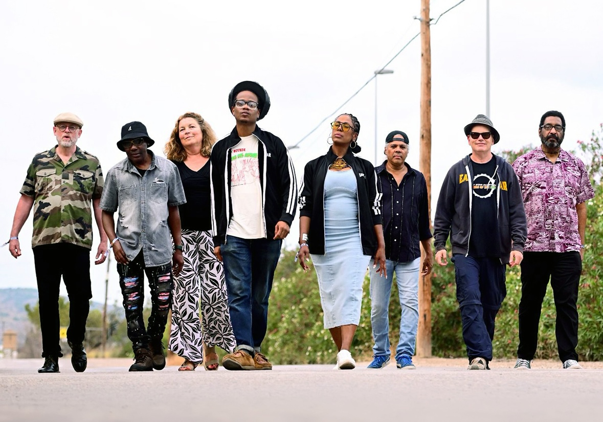 Photo of a band walking towards the camera