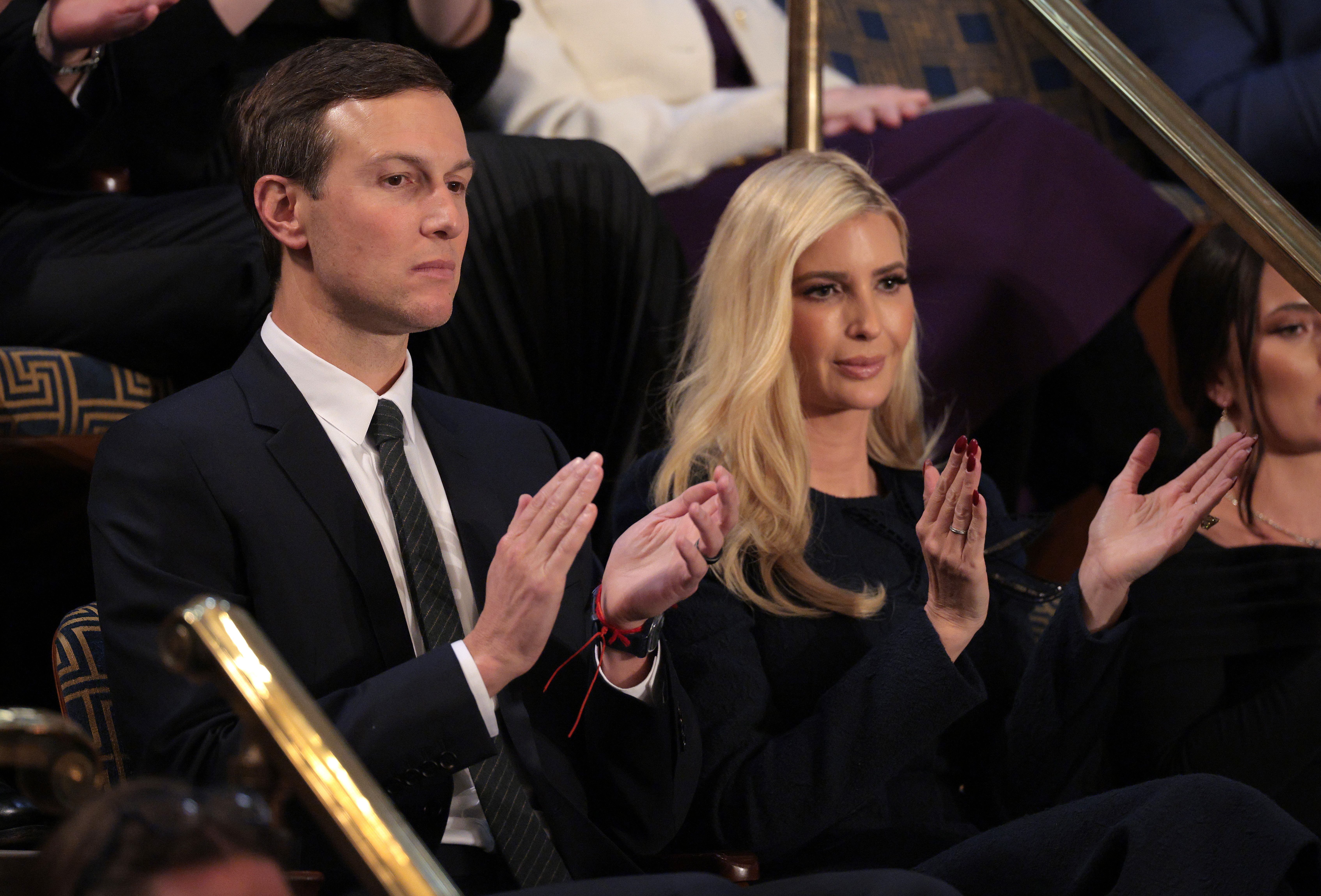 Jared Kushner and Ivanka Trump applaud among a crowd
